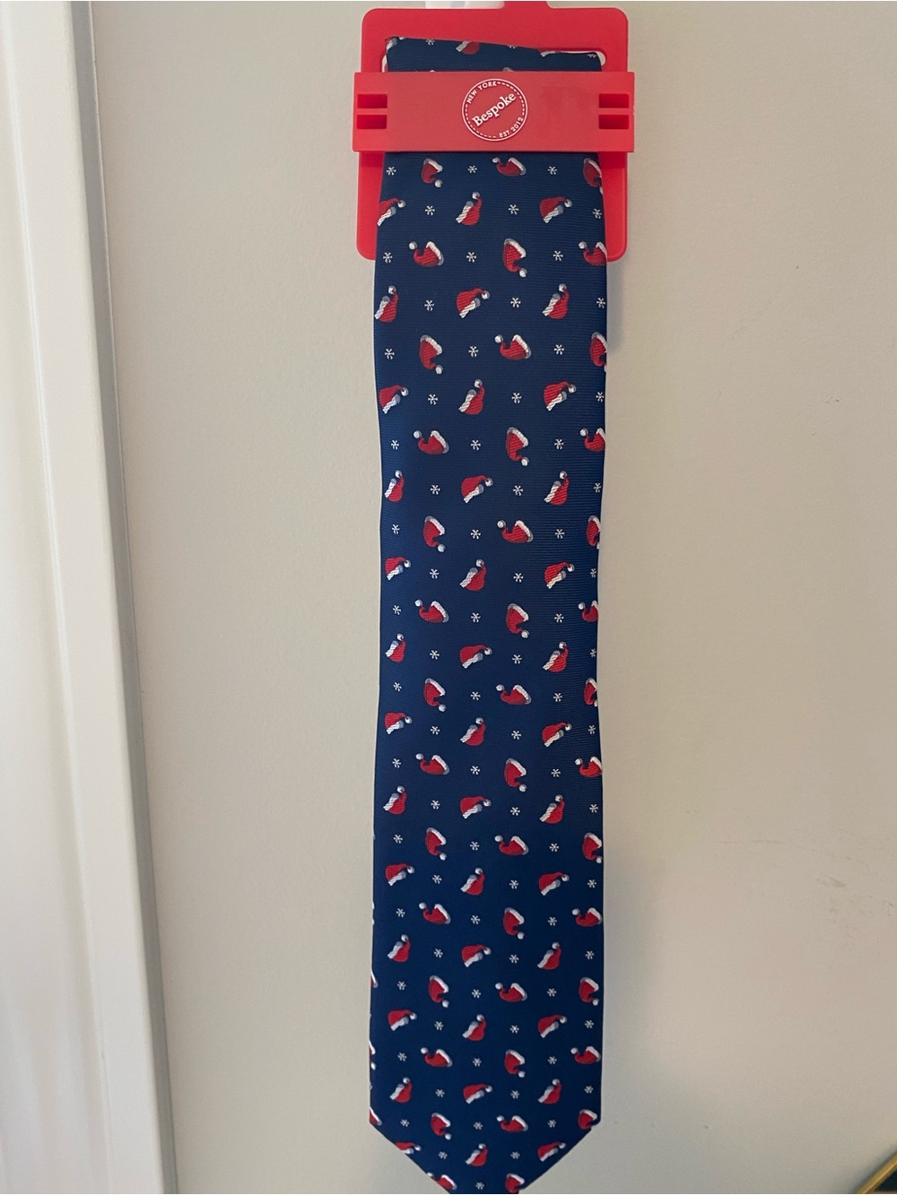 Bespoke Navy Blue Holiday Tie with Red Santa Hat Pattern